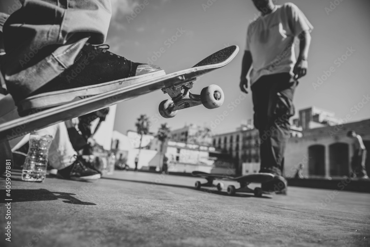 Picture of Low Section Of Men Skateboarding On Street