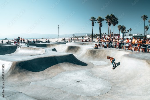 Picture of June 10 2018 Los Angeles USA Venice beach skate park by the ocean People skating at the skatepark showing different tricks 