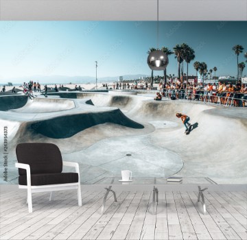 Picture of June 10 2018 Los Angeles USA Venice beach skate park by the ocean People skating at the skatepark showing different tricks 