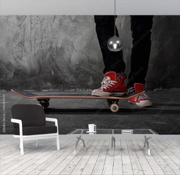 Picture of Legs in sneakers on a skateboard