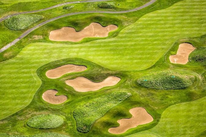 Aerial view of golf course photowallpaper Scandiwall