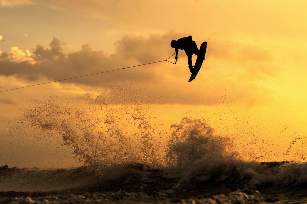 Picture of Wakeboarder Getting Air During Sunset