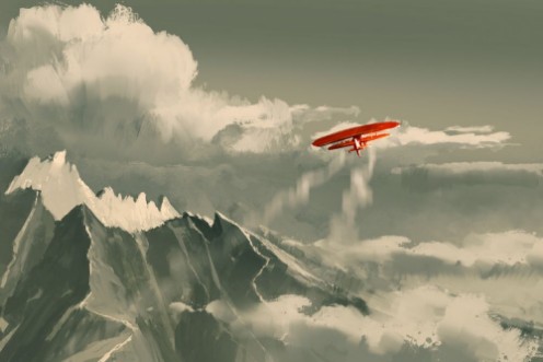 Picture of Biplane Flying over Mountain