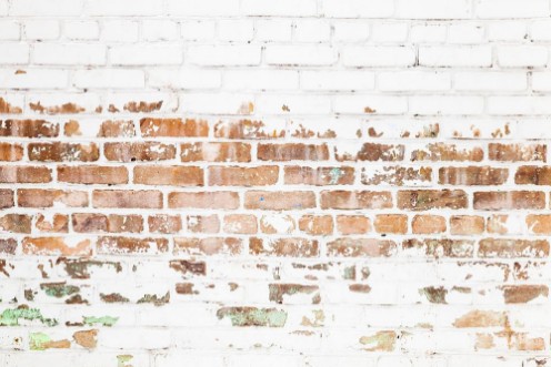 Image de Old red brick wall with damaged white paint layer
