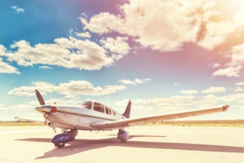 Afbeeldingen van Propeller plane parking at the airport