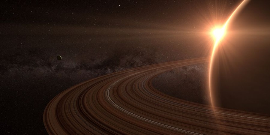 Bild på Planet saturn with rings at sunrise on the space background 