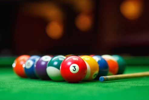Picture of Billiard balls in a green pool table