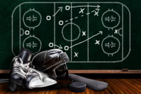 Afbeeldingen van Ice Hockey Equipment and Chalk Board Play Strategy