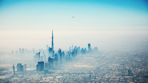 Bild på Dubai city in sunrise aerial view