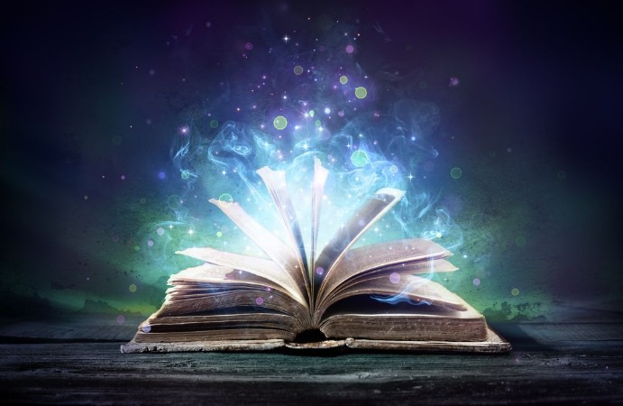 Bewitched Book With Magic Glows In The Darkness photowallpaper Scandiwall