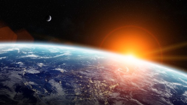 Bild på Sunrise over planet Earth in space
