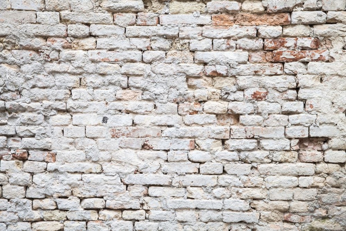 Image de Old red brick wall with white paint layer