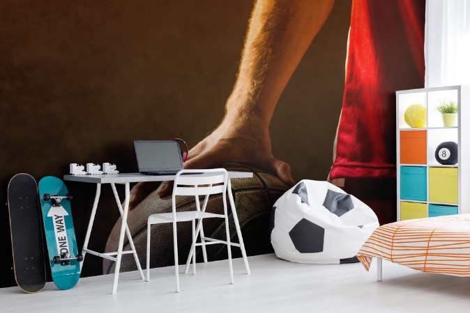 Picture of Close up on basketball held by basketball player