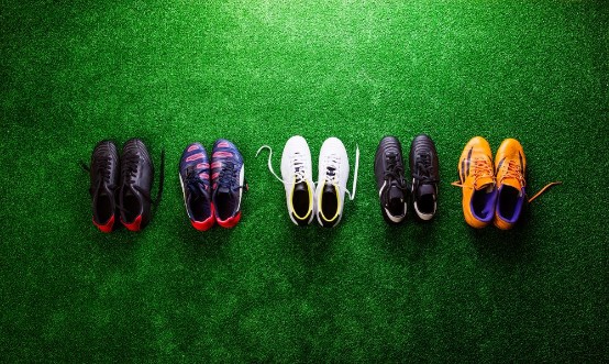 Picture of Various cleats against green artificial turf studio shot