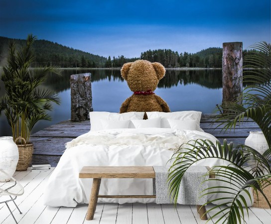 Afbeeldingen van Teddy bear sitting on a pier