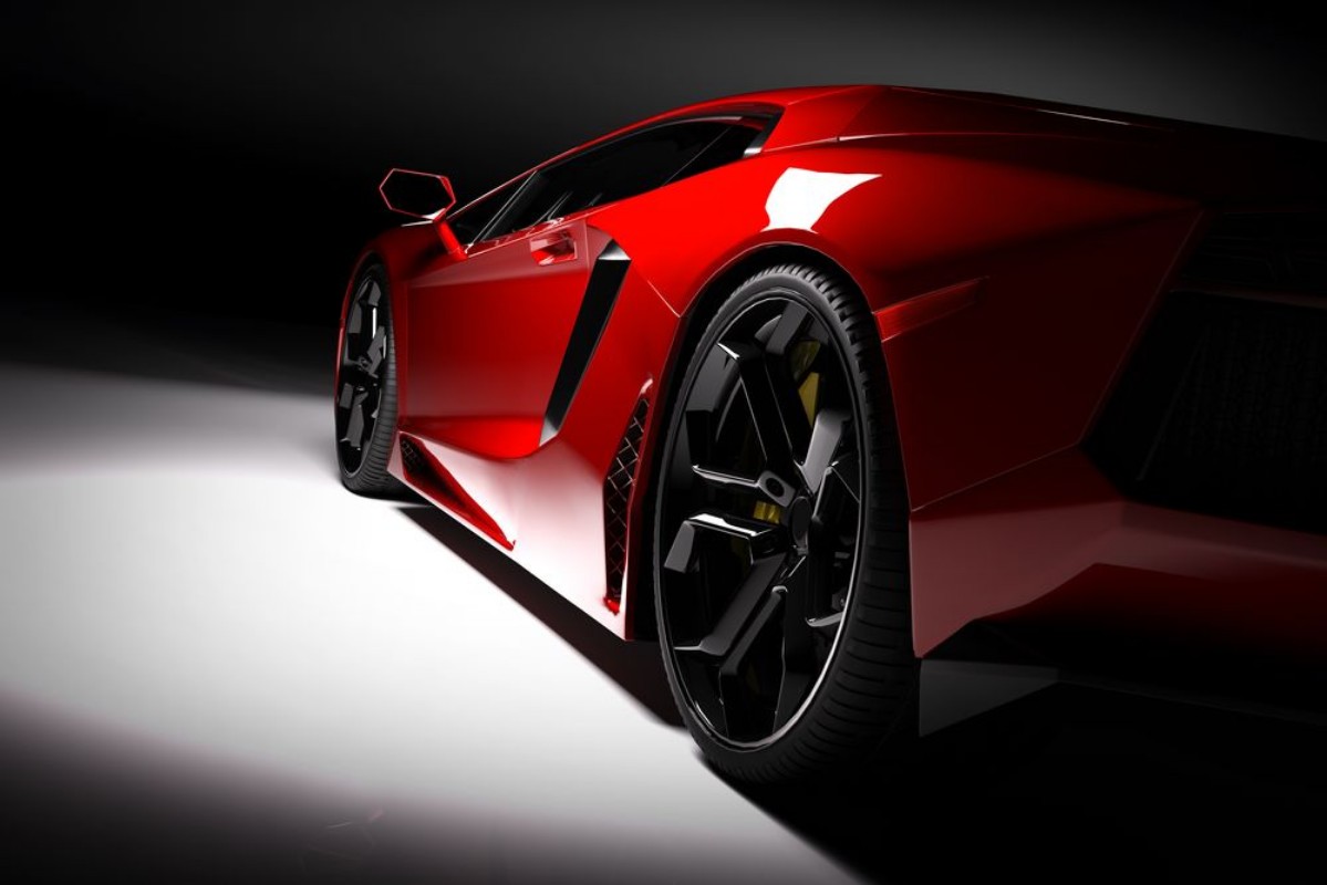 Bild på Red fast sports car in spotlight black background Shiny new luxurious