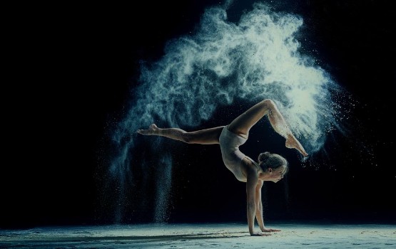 Bild på Graceful woman dancing in cloud of dust