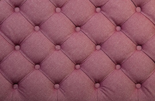 Bild på Pink capitone tufted fabric upholstery texture