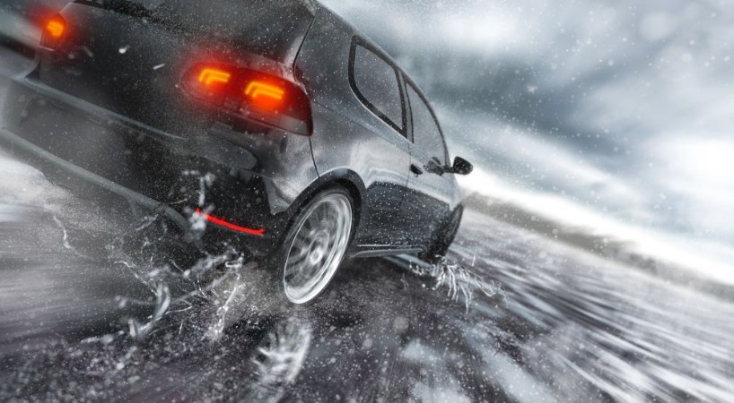 Picture of Fast Car driving fast on wet Road water is splashing around