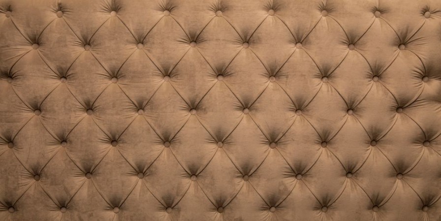 Afbeeldingen van Beige capitone tufted fabric upholstery texture