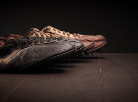 Bild på Grandpas sport shoes on wood