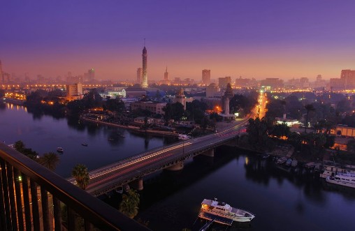 Picture of CAIRO - EGYPT - DECEMBER 2010 panorama of Cairo and Nile movement in morning sunrise view from top with Cairo Tower buildings auto and boats