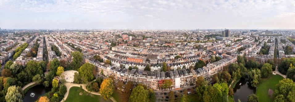 Bild på Aerial view of Amsterdam city roofs beside Sarphati park