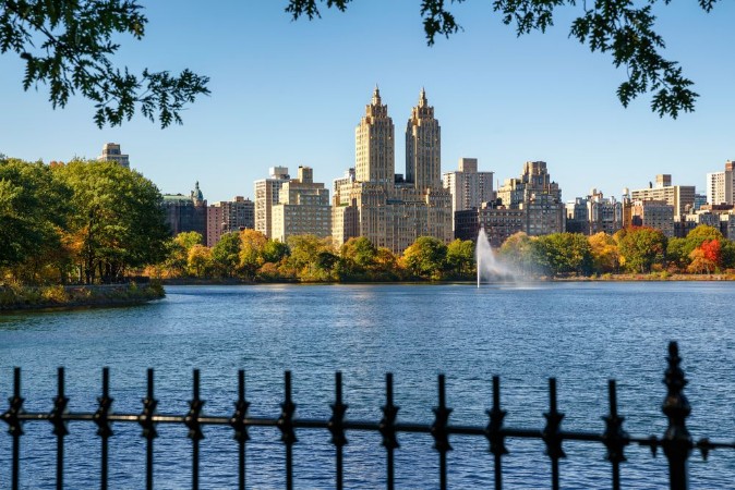 Picture of Manhattan Upper West Side with colorful fall foliage and fountain across Jacqueline Kennedy Onassis Reservoir Central Park West New York City