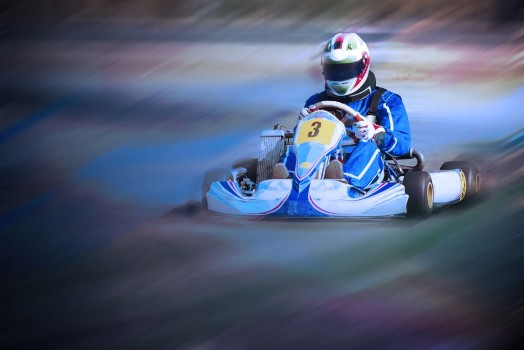 Picture of Karting - driver in helmet on kart circuit