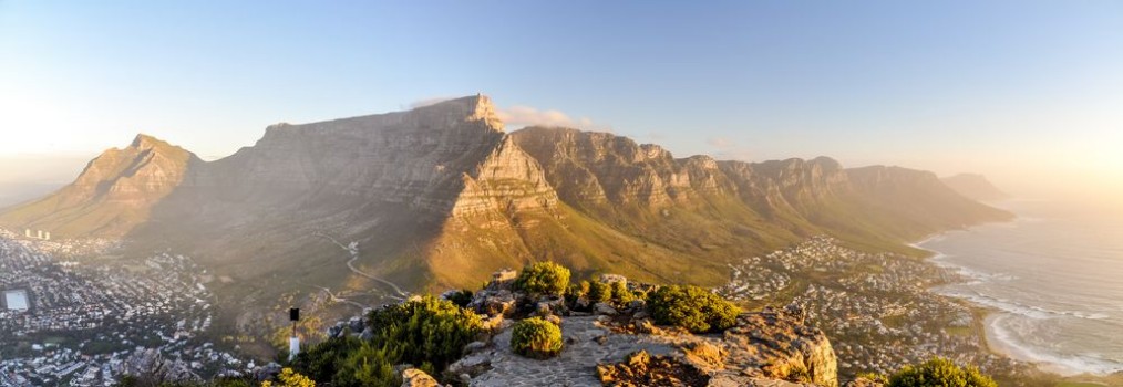 Picture of XXL panorama of Table Mountain and the Twelve Apostles mountain range seen from Lions Head near Signal Hil in the evening sun Camps Bay on the right city of Cape Town on the left South Africa