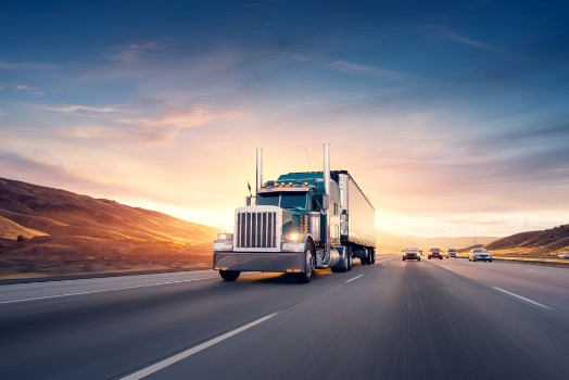Picture of American style truck on freeway pulling load Transportation the
