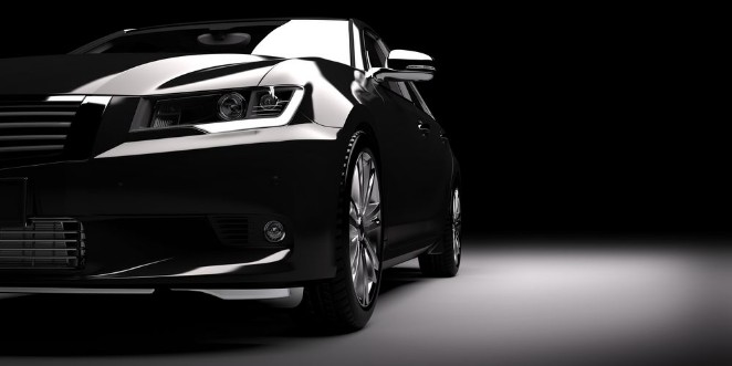 Afbeeldingen van New black metallic sedan car in spotlight Modern desing brandless
