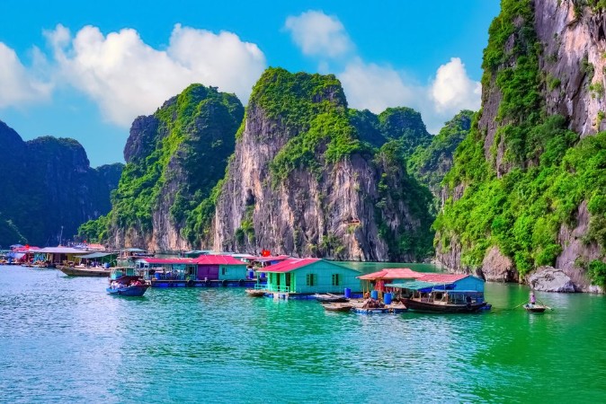 Picture of Floating fishing village rock island in Halong Bay Vietnam Southeast Asia UNESCO World Heritage Site Junk boat cruise to Ha Long Bay Landscape Popular asian landmark famous destination of Vietnam