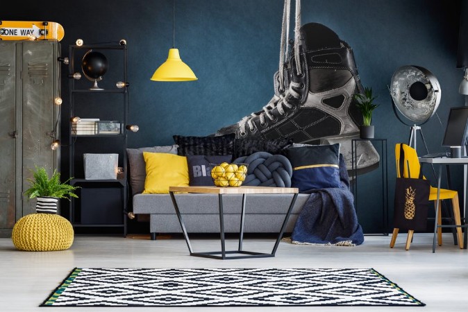 Picture of Mens hockey skates hanging on a dark background