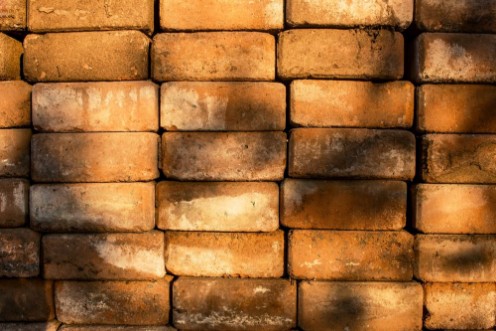 Bild på Brick Stact Texture Background with Sunlight Shading