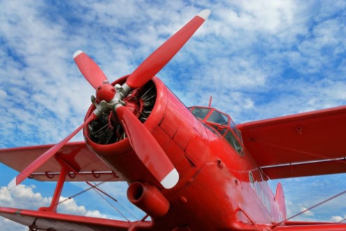 Afbeeldingen van Red airplane biplane with piston engine