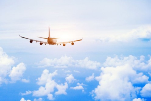 Afbeeldingen van Airplane fly in the sky international passenger flight travel concept background