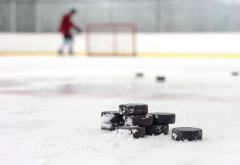 Picture of Hockey player with pucks