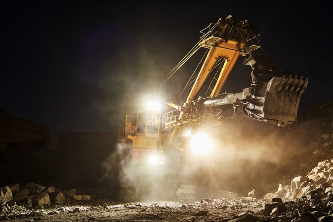 Image de Mining construction industry Excavator digging granite or ore in quarry