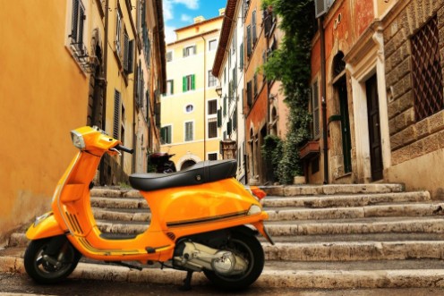 Picture of Orange vintage scooter on the background of Rome street
