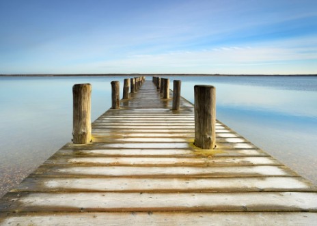 Image de Wooden Pier with Hoarfrost leads into a calm clear  lake