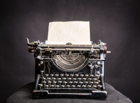 Picture of Vintage black typewrite with inserted paper sheet