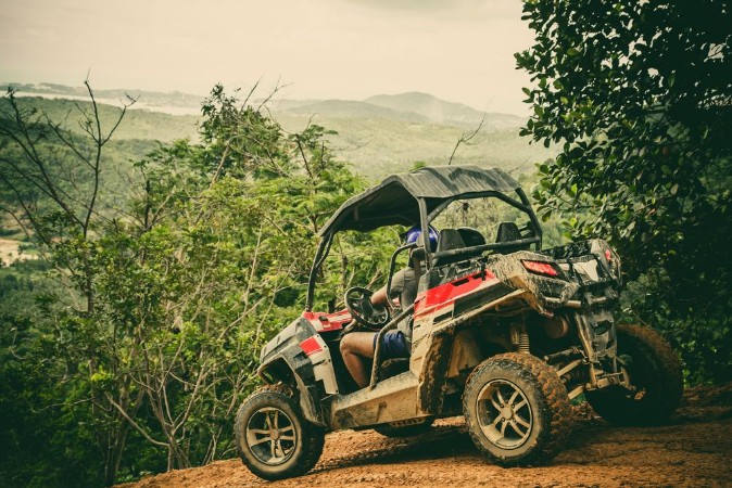 Bild på Extreme ride on ATV buggies jeeps Journey through the jungle Extreme quad biking dune buggy Jeep in the jungle forest  ATV UTV  in motion  toned image