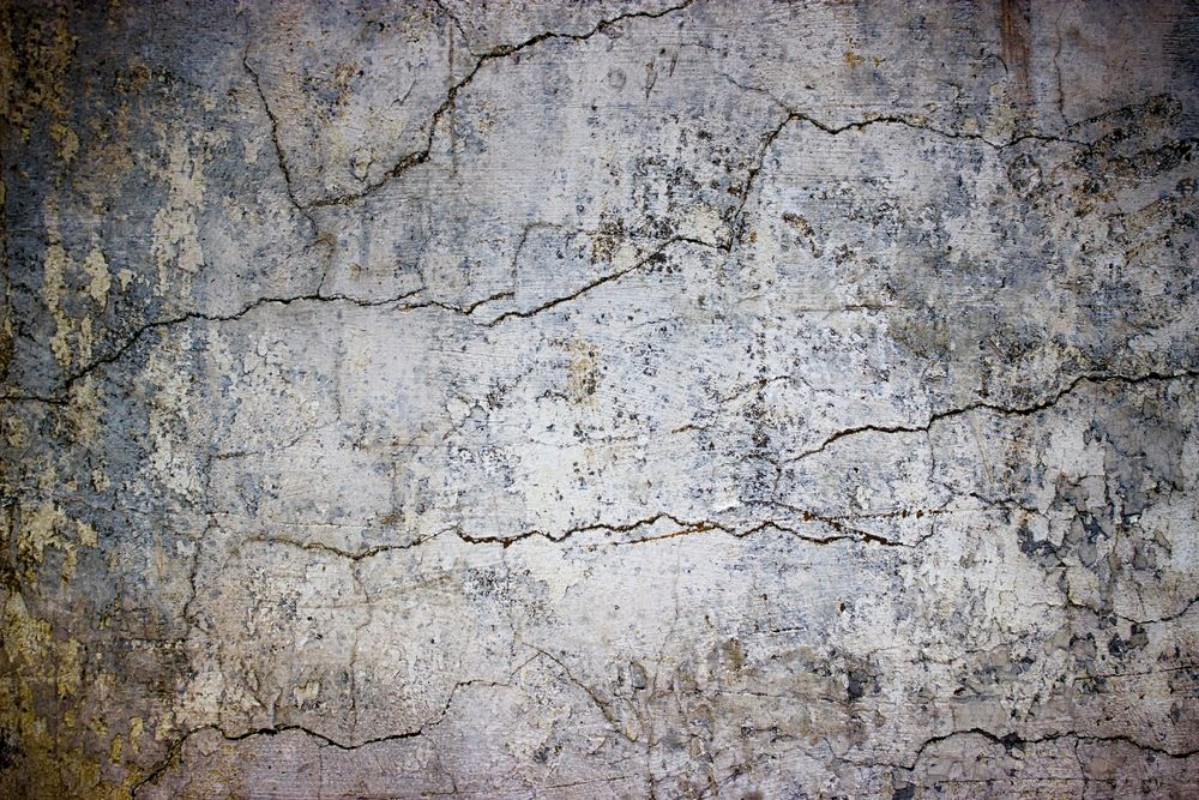 Afbeeldingen van Cracked concrete wall covered with gray cement texture as background for design