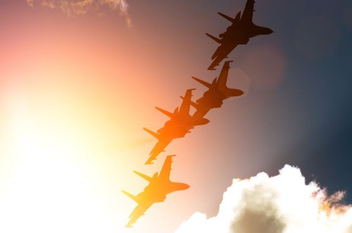 Image de Aircraft fighter jets against the background of sky and sun