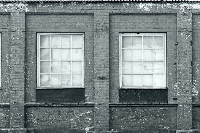 Picture of Brick wall of an old factory with windows