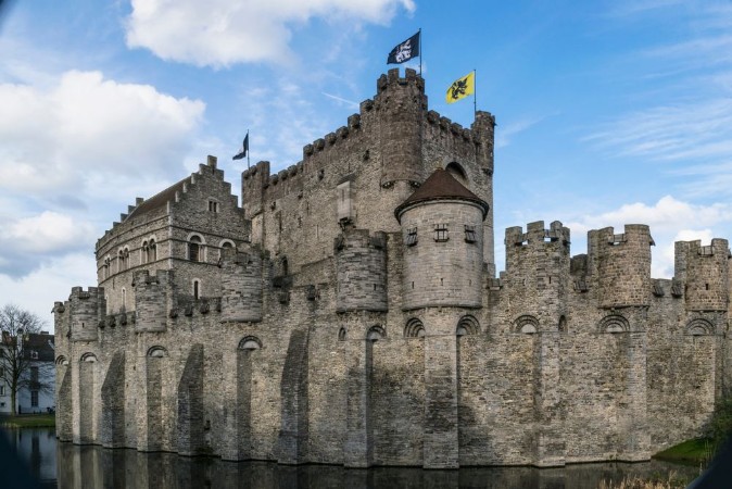 Bild på Towers and walls of the medieval Gravensteen castle in Ghent Belgium on a sunny March morning
