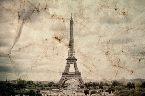Picture of Eiffel Tower in Paris Vintage view background Tour Eiffel old retro style photo with cracks crumpled paper Postcard style 