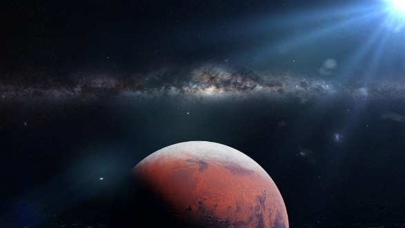 Picture of Planet Mars during the Martian winter in front of the Milky Way galaxy and the sun