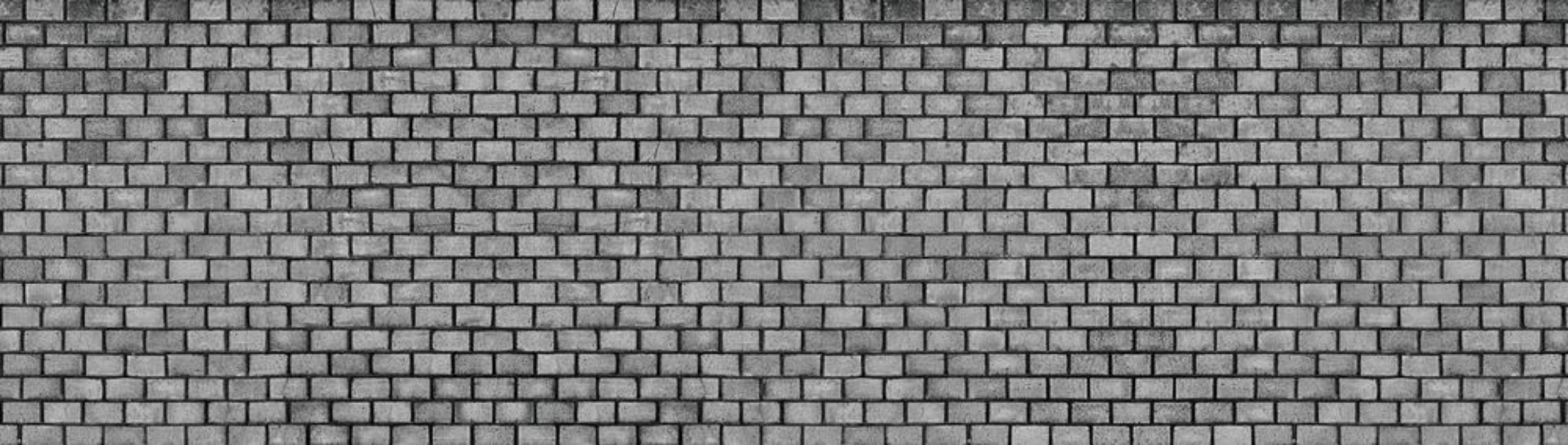 Bild på Dark brick wall texture of black stone blocks high resolution panorama
